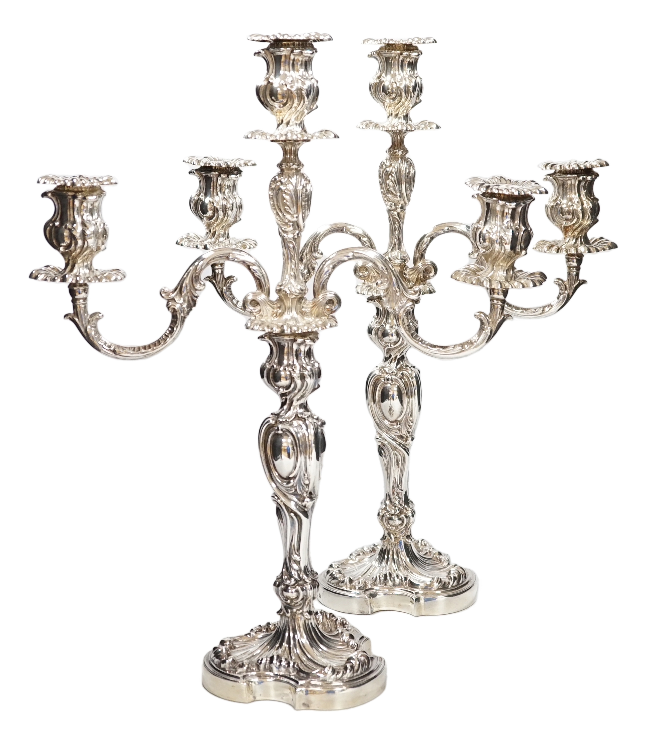A good pair of late Victorian Elkington & Co. silver twin branch, three light candelabra